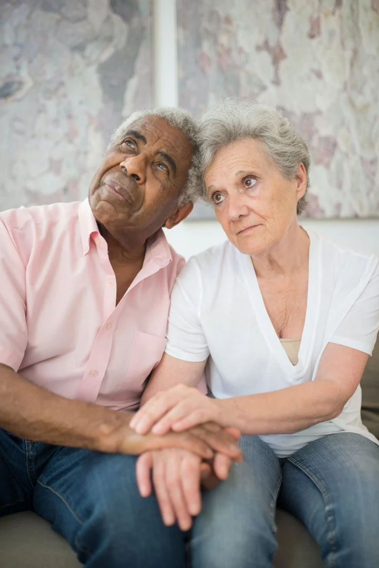 Old Age Couple Sitting in Depression